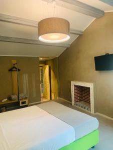 Łóżko lub łóżka w pokoju w obiekcie Hotel Conca D'Oro ***S