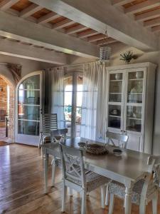 a dining room with a table and chairs at Dimora Degli Angeli in Chianni