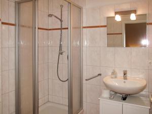 a bathroom with a shower and a sink at Apartment am Haferland by Interhome in Wieck