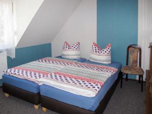 a bedroom with a bed with pillows on it at Apartment Mary by Interhome in Karlsburg