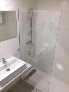 a bathroom with a shower and a sink at Oleander in Playa de Palma