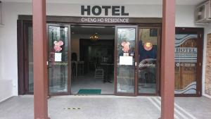 an entrance to a hotel with glass doors at Cheng Ho Hotel in Melaka