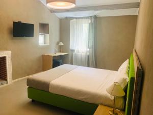 Łóżko lub łóżka w pokoju w obiekcie Hotel Conca D'Oro ***S
