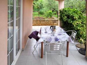 a table and chairs sitting on a patio at Apartment Giuliano-3 by Interhome in Frata