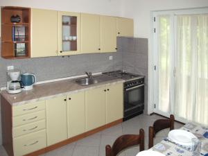 a kitchen with a sink and a stove at Apartment Giuliano-1 by Interhome in Frata