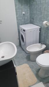 a bathroom with a toilet and a sink at Apartments Vera Barbariga in Barbariga