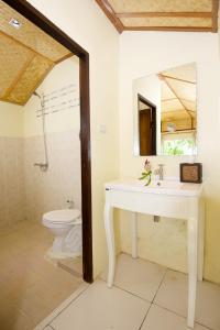 a bathroom with a sink and a toilet at Bubble Bungalow in Ko Tao