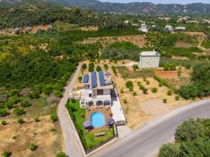 an aerial view of a house with a swimming pool at Aphrodite's house in Alikianós
