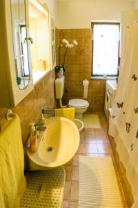 a bathroom with a sink and a toilet at Holiday Home Palma - MVN202 by Interhome in Karojba