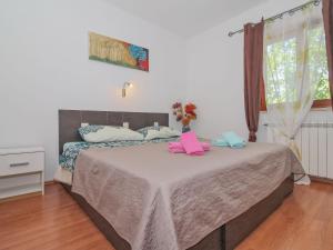 Postel nebo postele na pokoji v ubytování Holiday Home Villa Simac - PZN215 by Interhome