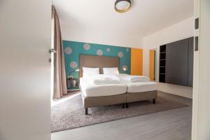 Ein Bett oder Betten in einem Zimmer der Unterkunft Blackhome Salzburg City I contactless check-in