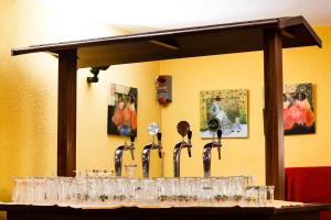 a display of glasses on a table in a room at Hotel Biancaneve in Sestriere