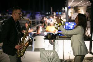 a woman playing a saxophone and a man playing a saxophone at Apartments Marina Novi in Novi Vinodolski