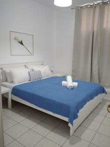 Postel nebo postele na pokoji v ubytování Kavala Home 1