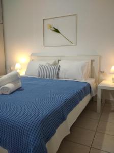 Postel nebo postele na pokoji v ubytování Kavala Home 1