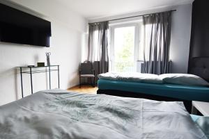 Ein Bett oder Betten in einem Zimmer der Unterkunft Dorya am Ring