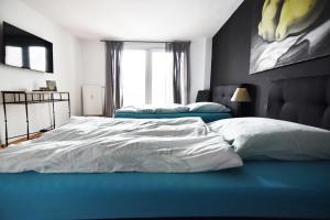 Ein Bett oder Betten in einem Zimmer der Unterkunft Dorya am Ring