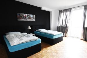 Ein Bett oder Betten in einem Zimmer der Unterkunft Dorya am Ring