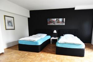 Ein Bett oder Betten in einem Zimmer der Unterkunft Dorya am Ring