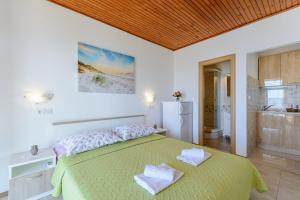 Postel nebo postele na pokoji v ubytování Rooms Sani