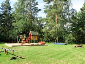 a park with a playground with a slide at Holiday Home Möwennest by Interhome in Funfseen