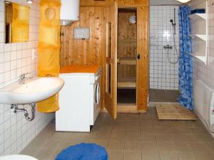 a small bathroom with a sink and a shower at Holiday Home Kapitänshaus Leo by Interhome in Leopoldshagen
