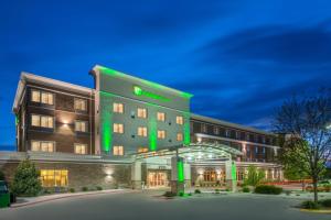 a hotel with green lights on the front of it at Holiday Inn Hotel & Suites Grand Junction-Airport by IHG in Grand Junction