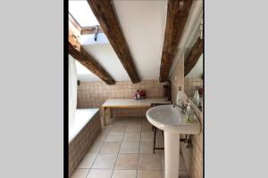 a bathroom with a sink and a bath tub at COZY ROMANTIC MALASAÑA in Madrid