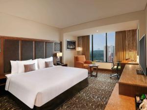 Novotel Kochi Infopark客房内的一张或多张床位