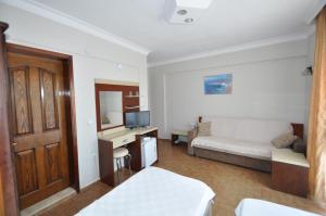 Postel nebo postele na pokoji v ubytování Defne & Zevkim Hotel + 37 fotografií