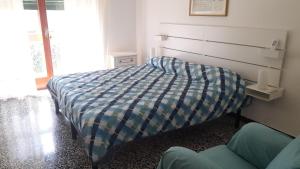 Un pat sau paturi într-o cameră la Villa Elena