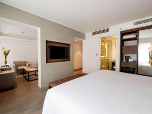 Postel nebo postele na pokoji v ubytování Mercure Ariosto Lima