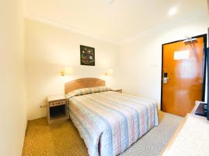 Postel nebo postele na pokoji v ubytování Hotel Rainbow