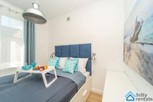 Posteľ alebo postele v izbe v ubytovaní Nowoczesny Apartament 3city w Gdyni z Parkingiem by Noclegi Renters