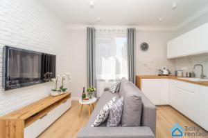 Kuchyňa alebo kuchynka v ubytovaní Nowoczesny Apartament 3city w Gdyni z Parkingiem by Noclegi Renters