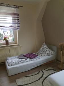 Ένα ή περισσότερα κρεβάτια σε δωμάτιο στο Ferienwohnung Alina, Limbach-Oberfrohna +11 φωτογραφίες