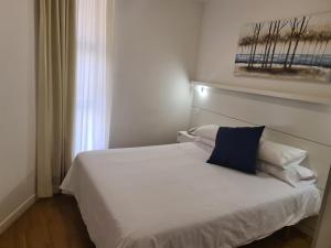 Postel nebo postele na pokoji v ubytování Hotel Jacobeo