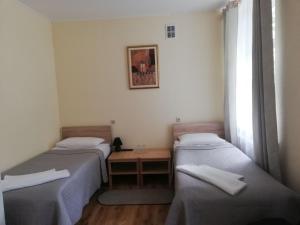 سرير أو أسرّة في غرفة في Villa Verdaine