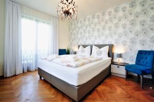 Ένα ή περισσότερα κρεβάτια σε δωμάτιο στο MARTINIHOF - Bad Tatzmannsdorf