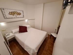 Postel nebo postele na pokoji v ubytování Hotel Jacobeo