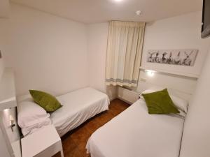 Postel nebo postele na pokoji v ubytování Hotel Jacobeo