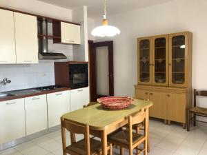 a kitchen with a table with a bowl on it at Residenza Iris vista mare in Gallipoli