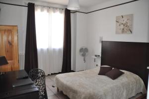 Postel nebo postele na pokoji v ubytování Hôtel Saint George