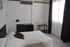 Postel nebo postele na pokoji v ubytování Hôtel Saint George