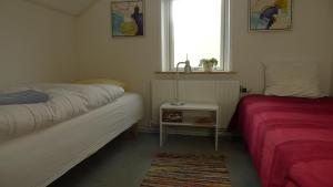 En eller flere senge i et værelse på Sysselbjerg Bed & Breakfast