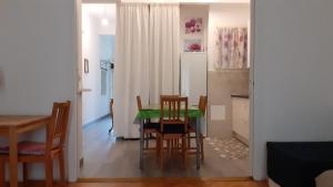 a kitchen and dining room with a table and chairs at Apartment Palais de Coppet in Nice