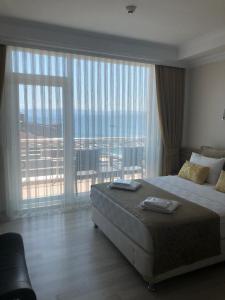 Postel nebo postele na pokoji v ubytování Sinopark Hotel