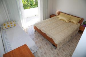 Posteľ alebo postele v izbe v ubytovaní Apartments Butkovic