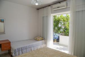 Posteľ alebo postele v izbe v ubytovaní Apartments Butkovic