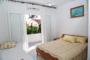 Posteľ alebo postele v izbe v ubytovaní Apartments Butkovic